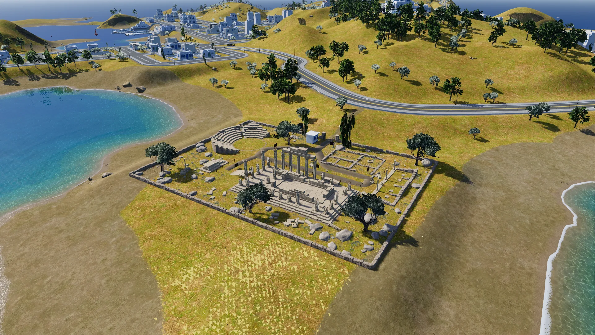 Close aerial of the ancient temple ruins with columns, a small theatre and olive trees