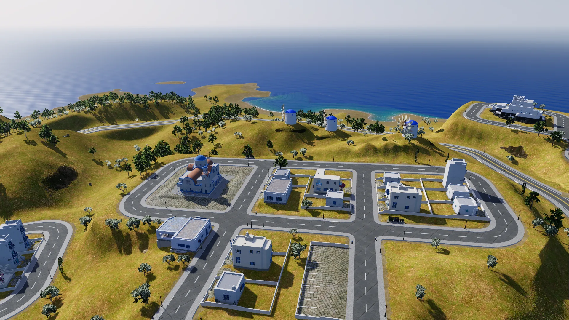 Old Town from the air: the blue-domed church plaza with windmills on the ridge and the sea beyond